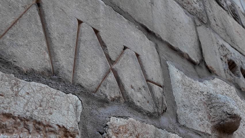 Close-Up Shot of Ancient Greek Inscriptions Carved on the Stone Wall of Augustus Temple in Ankara, 4K Historical Archaeological Video