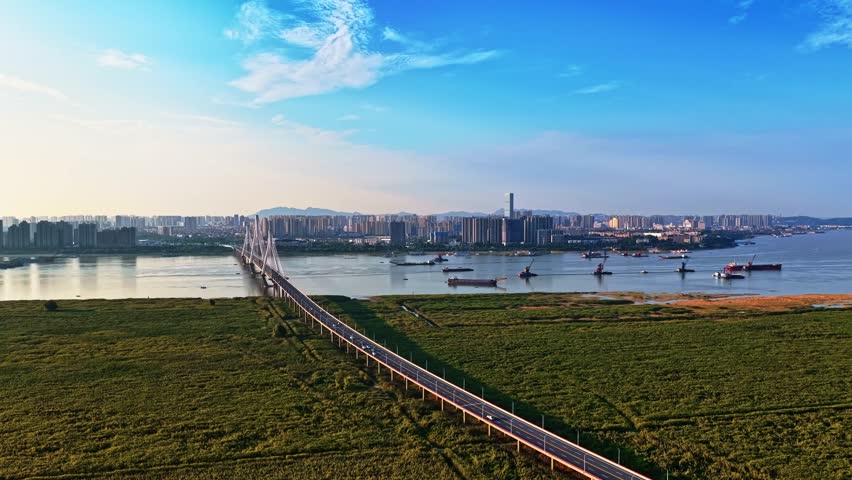 The Chenglingji port and shipping area where the Yangtze River meets the Dongting Lake showcases the port activities and industrial landscape of Yueyang City, Hunan Province, China.