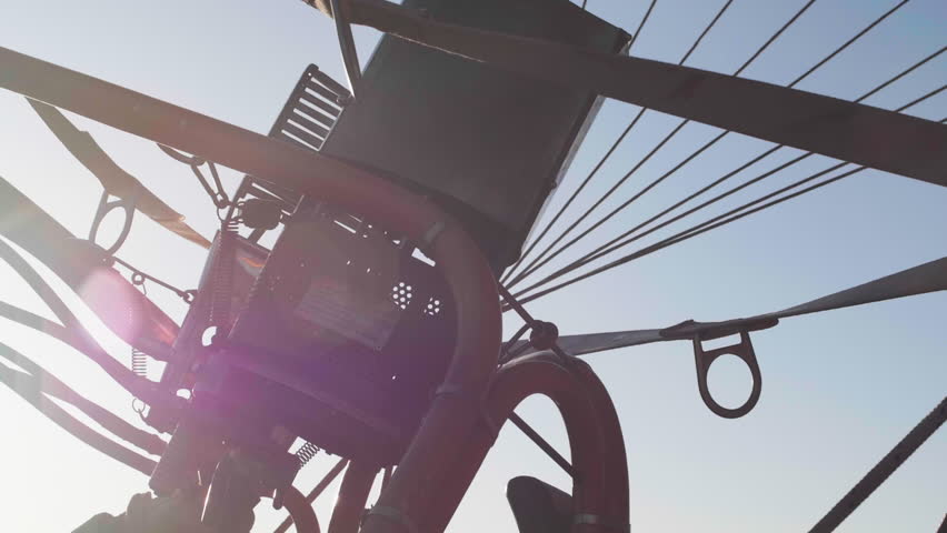 Hot Air Balloon and Burner Flames, Recreational Aircraft, Ballooning, Taking Flight, Transportation, Aircraft, Tourist Activity, Blue Sky, Morning Light, New Mexico, American Southwest USA