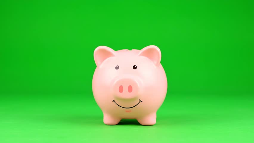 jumping piggy bank with green background