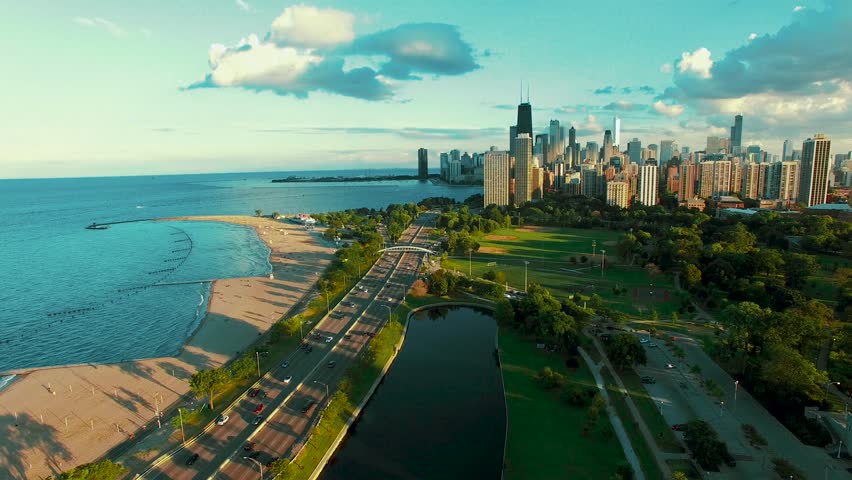 Scenic Chicago lakefront park with walking paths, greenery, and city skyline, outdoor recreation, urban nature, leisure, and tourism concept by Lake Michigan.