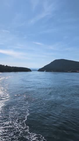 View from a ferry heading into port, passing through a narrow section of the archipelago on Vancouver Island - summer sunny day, British Columbia, Canada