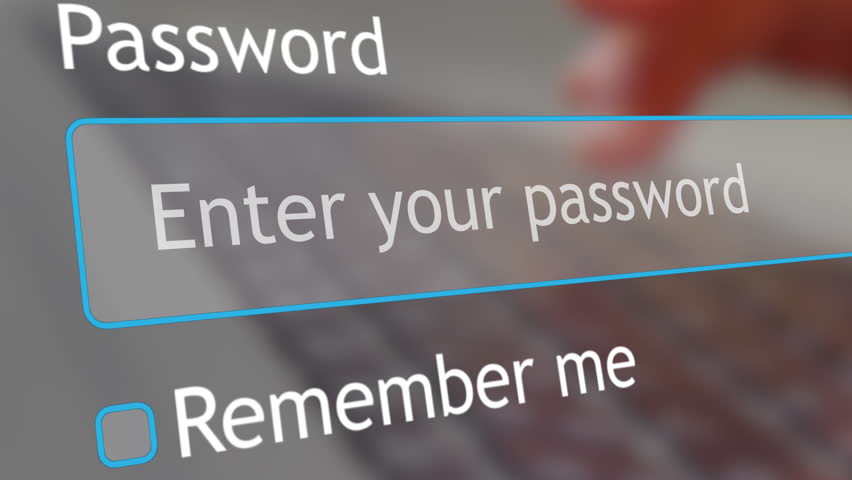 A woman types her password into a website form on her computer. The focus is on her fingers and the password entry. This highlights a common online activity.