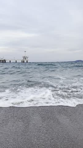 Collage of ocean landscapes with gentle waves, turquoise water texture, and golden sunset over the sea horizon. Peaceful natural seascape background captured during a calm evening by the shore. Travel