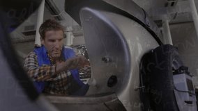 Animation of mathematical equations over caucasian male mechanic in workshop. Global business and digital interface concept digitally generated video. - Powered by Shutterstock - Get 15% off with code: PIKWIZARD15