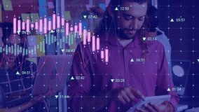 Animation of financial data processing over man using digital tablet at office. Global finance and business technology concept - Powered by Shutterstock - Get 15% off with code: PIKWIZARD15