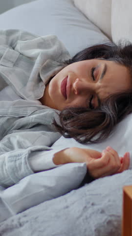 Caucasian woman waking up in morning suffering belly paIn ache menstrual spasm discomfort painful cramp stomach aching female girl lying in bed unhealthy sick ill abdomen discomfort awaking in bedroom
