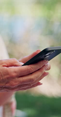 Old woman, hands and typing outdoor with phone, browsing internet and social media for online news. Senior person, scroll and search with tech for text message, reading digital article and blog post.