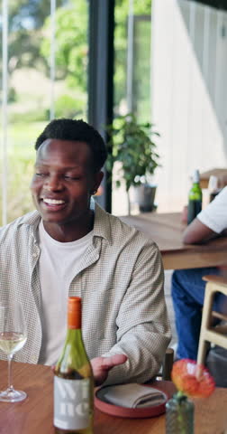 Happy, friends and man in restaurant with wine for social gathering, reunion and tasting event. Talking, weekend and people with alcohol, drinks and cheers for bonding, connection and celebration