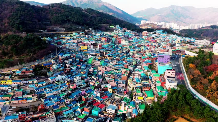 Aerial view of Gamcheon Culture Village in Busan, South Korea. Colorful houses built in a staircase pattern on coastal foothills, nicknamed “Machu Picchu of Busan,” showcasing unique urban architecture and scenic hillside layout.