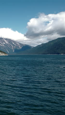 Clouds Over Mountains. Vivid Cloud Formations Cast Shadows On Turbulent Mountainsea Environment. Media