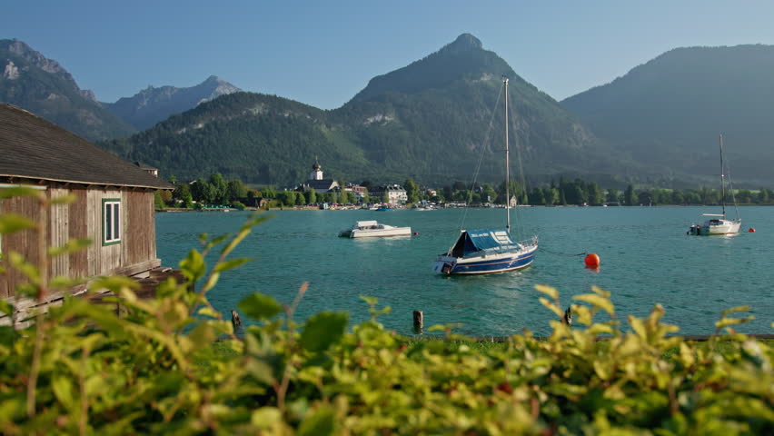 Beautiful boats on the shore of Wolfgangsee Austria. Tourist points and alpine landscapes in Europe.