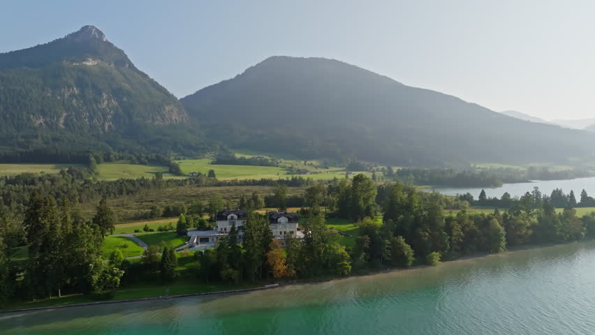 Scenic aerial view of Lake Wolfgangsee Austria with mountain ranges alpine nature and picturesque landscape attracting tourists in Europe