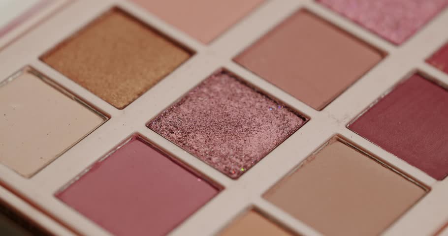 Close-up slow motion shot of a professional makeup artist