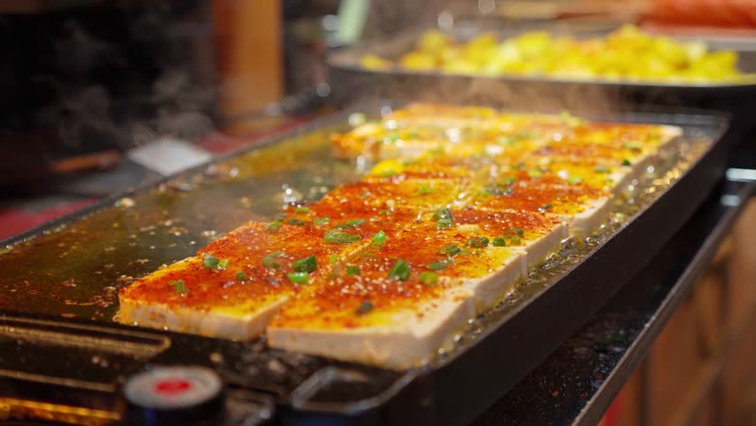 Fried tofu sold at the street food market in China