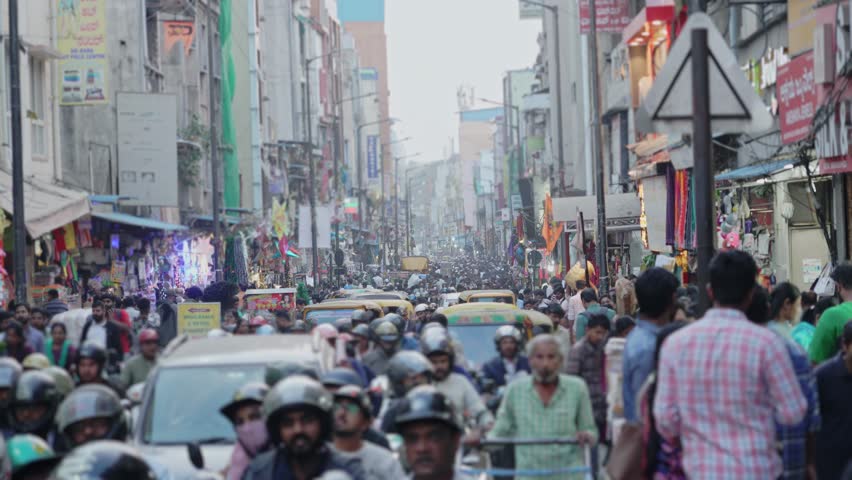 Bengaluru-India-January 6-2026-People walking through crowded Indian street market.