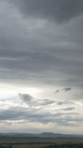Dramatic Overcast Cloudy Sky with Layered Storm Clouds Over Landscape
