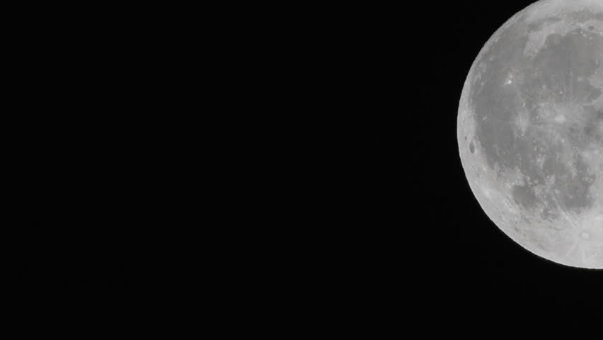 Moon, space, astronomy: Detailed close-up of the bright full moon against a dark night sky