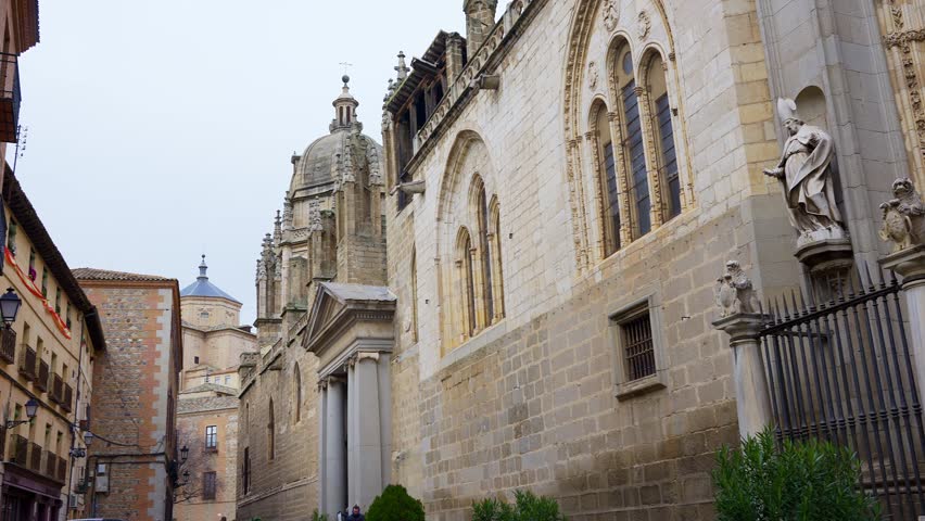 Access door on the side facade of the impressive cathedral of Toledo, Spain.