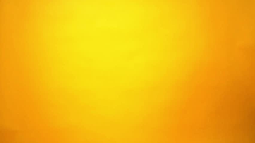 Close up of a hand holding a Be My Valentine’s Day gift bag shaped like a red truck with confetti hearts decorations and a love message on a bright yellow background. Cheerful romantic concept with copy space for holiday promotions, greeting cards, and love themed designs