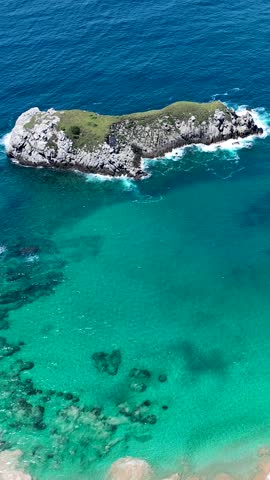 Seascape volcano mountains and beach at archipelago of Fernando de Noronha Brazil. Tropical volcano islands at Fernando de Noronha archipelago. Vacation travel. Tropical destination.