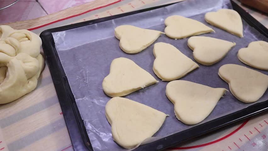 In this video we have shown heart shape cookies dough  diaplying in the tray