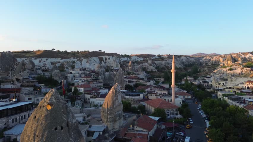 Aerial View of Cappadocia City at Sunset with Traditional Stone Houses, Turkey