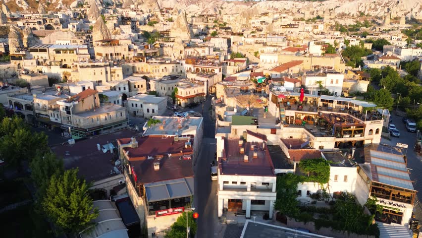 Aerial View of Cappadocia City at Sunset with Traditional Stone Houses, Turkey