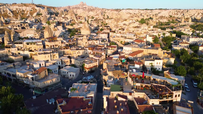 Aerial View of Cappadocia City at Sunset with Traditional Stone Houses, Turkey