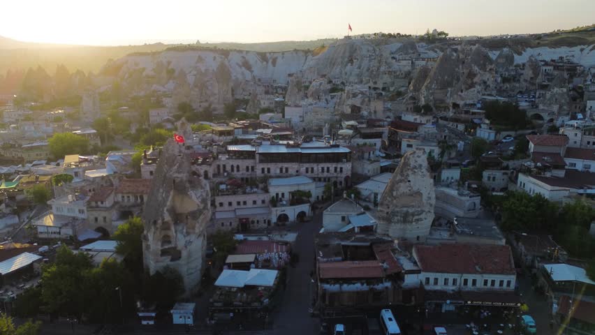 Aerial View of Cappadocia City at Sunset with Traditional Stone Houses, Turkey