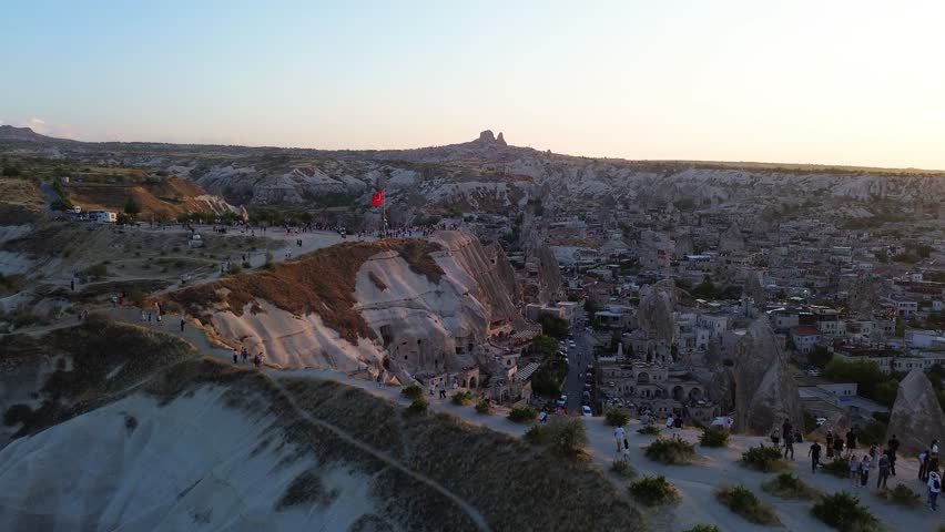Aerial View of Cappadocia City at Sunset with Traditional Stone Houses, Turkey