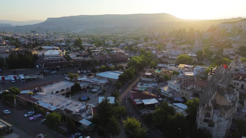 Aerial View of Cappadocia City at Sunset with Traditional Stone Houses, Turkey