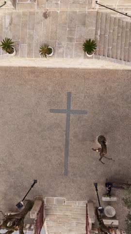 Religious cross on cobblestones, Portugal