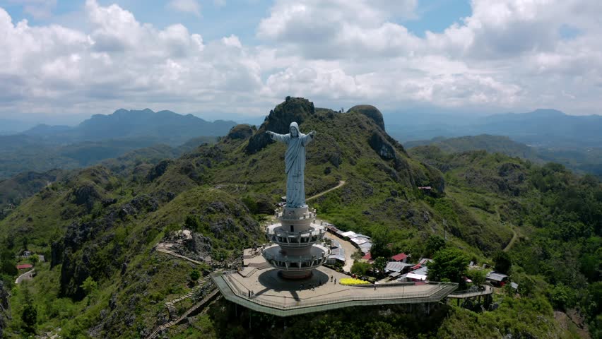 a big jesust christ statue on the top of the hill that located on toraja, indonesia