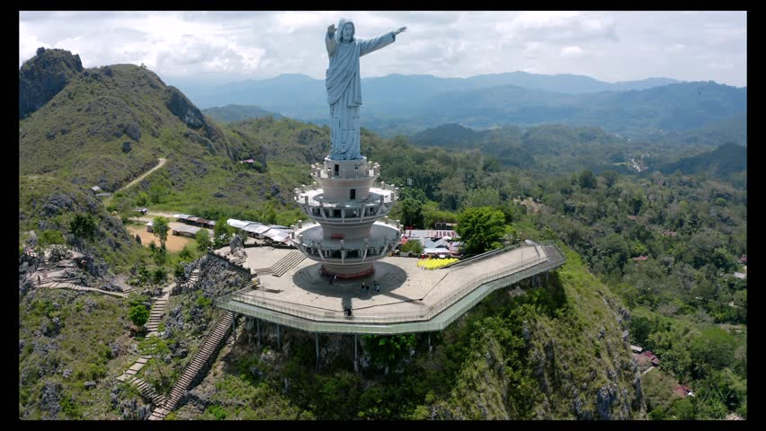a big jesust christ statue on the top of the hill that located on toraja, indonesia