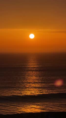 Intense Orange Sunset Over Atlantic Ocean.

Dramatic orange sunset over the Atlantic Ocean with glowing reflections and vibrant sky.