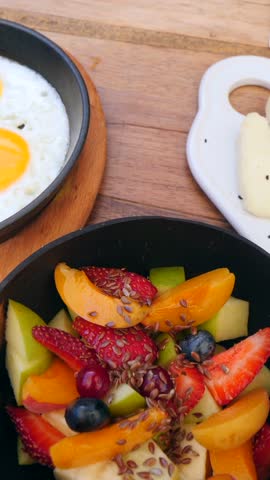 Vertical video of Healthy Breakfast Table with Eggs, Cheese, Fruit and Coffee - Brunch table, stylish breakfast table