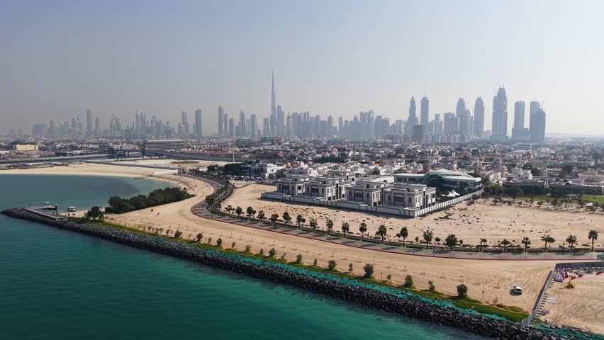 Flight towards Jumeirah Beach with Dubai skyline in the background, UAE
