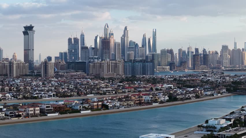Luxury villas on Palm Jumeirah with Dubai Marina in the background, Dubai, UAE