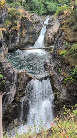  Little Qualicum Falls - Clear and cold blue water Waterfall  rushes through the gorge and Forest River. Rainforest nature, Vancouver Island, BC, Canada