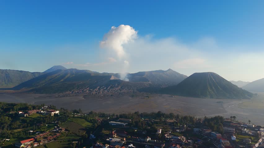 Mountain village of Cemoro Lawang seen from above with volcanic landscape
