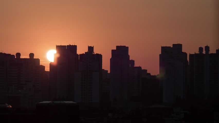 Time-lapse of the sun rising over the horizon, with changing colors in the sky symbolizing new beginnings, hope, and the start of a new day.