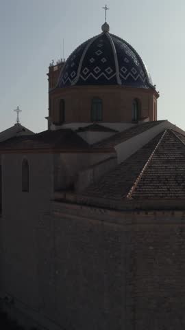 Smooth vertical crane movement revealing the Church of Our Lady of Consuelo, a landmark of Altea’s historic center.