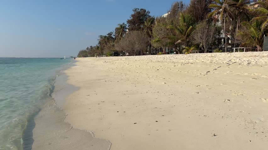 Hulhumalé beach Maldives with calm turquoise water and wide white sand shoreline