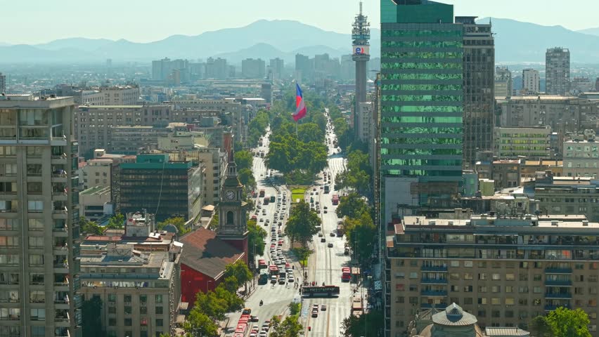 Aerial View of Chilean Flag Over Alameda Avenue and San Francisco Church in Santiago