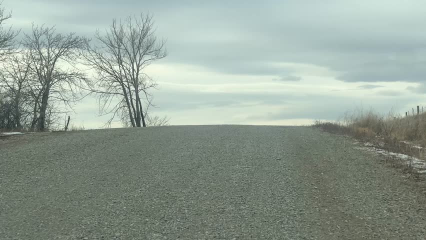 Driving Through Rural Alberta Gravel Road Drivers POV. Siksika Nation Albert Canada. 