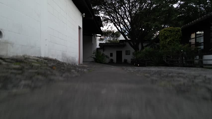 antigua guatemala sunset (scenic view of fuego acatenango volcanic eruption with cloud formation merced church agua) nightfall night time cityscape aerial drone view colorful sky volcanic highlands