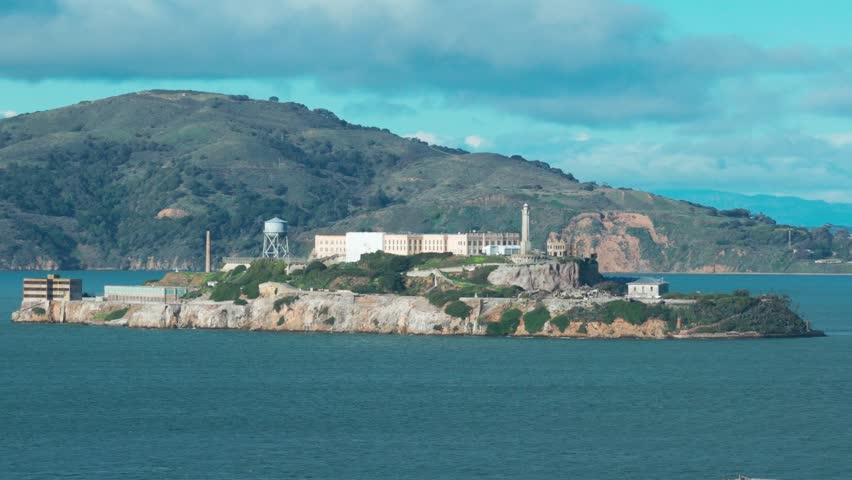 Low telephoto aerial shot of Alcatraz across the bay in San Francisco, California. 4K