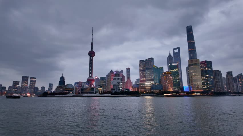 Shanghai, China: Panoramic footage of Shanghai skyline facing the skyscrapers of Pudong financial district at dusk in China.