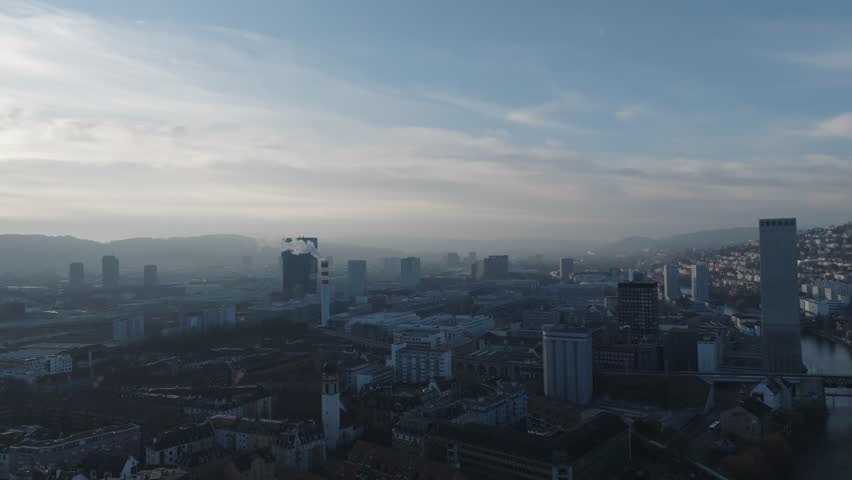 Aerial view of industrial district of Swiss city of Zürich on a Sunday sunset with cityscape and skyline. Movie shot February 1st, 2026, Zurich, Switzerland.